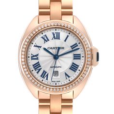 Cartier Cle Rose Gold Diamond Automatic Ladies Watch WJCL0003 Box Papers. Automatic self-winding movement. Round 18K rose gold  case 31 mm in diameter. Flush-mounted crown set with the blue sapphire cabochon. 18K rose gold original Cartier factory diamond bezel. Scratch resistant sapphire crystal. Flinque dial with a sunray guilloche pattern center and roman numerals. Blue sword shape hands. Minute markers around an inner ring. Date window at 6 o'clock. 18k rose gold bracelet with double deploya Rose Gold Watch With Metal Dial For Anniversary, Rose Gold Watches With Metal Dial For Anniversary, Luxury Self-winding Round Dial Watches, Luxury Self-winding Watch As A Gift, Elegant Cartier Watch Accessories With Date Indicator, Classic Self-winding Watch With Round Dial, Classic Self-winding Watches, Luxury Self-winding Watches For Anniversary, Formal Rose Gold Jewelry And Watches With Metal Dial