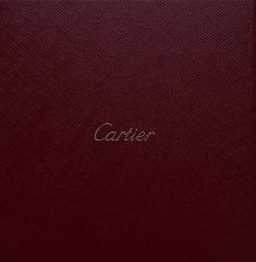 a red book with the word carrier written in gold on it's front cover