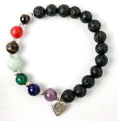 Semi-precious Gemstone 7 Chakra Bracelet, Hill Tribes Fine Silver Heart Charm, Lava Stone Bracelet, 8mm Beads, Handcrafted in CA.This lovely Chakra bracelet is handcrafted with 8mm lava & semi-precious gemstone beads, Hill Tribes high-purity fine silver heart charm, and Sterling Silver spacers. The stones in this bracelet for each Chakra are:• Amethyst for Crown• Lapis Lazuli for Third-Eye• Turquoise for Throat• Amazonite for Heart• Tiger Eye for Solar Plexus• Carnelian for Sacral• Garnet for Ro Spiritual Heart Beads Bracelet Gift, Heart-shaped Natural Stone Beaded Bracelets For Gifts, Heart-shaped Natural Stone Beaded Bracelets As Gift, Heart-shaped Beaded Bracelets With Natural Stones For Gift, Heart-shaped Natural Stone Beaded Bracelet Gift, Spiritual Beaded Bracelet With Heart Beads For Gifts, Spiritual Crystal Bracelet With Heart And Round Beads, Heart-shaped Healing Beaded Bracelets, Heart-shaped Adjustable Gemstone Beads Bracelet