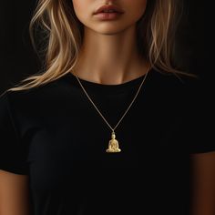 Find peace and enlightenment with our gold Buddha pendant, exquisitely crafted in the USA. Symbolizing serenity, wisdom, and spiritual awakening, each piece is a sanctuary of calm and reflection. PENDANT INFORMATIONThis pendant is made of real, solid gold.• Made in USA• Material: 14k or 18k solid gold• Finish: polished• Height: 1.25" (31,5 mm) x Width: 0.92" (23,5 mm)• Pendant weight: approx. 6 grams (14k)• Bail: fits up to 4 mm chains• Solid back, not hollow• A certificate of authenticity is included• Delivered in our elegant jewelry box, making it the perfect gift Shipping: All of our orders are custom-made. Please allow approximately 3 weeks for production and shipping. Shipping includes a tracking number and signature confirmation. The production timeline is an estimate and may fluctua Spiritual Large Pendant Jewelry For Meditation, Spiritual Yellow Gold Pendant Necklace, Spiritual Gold Jewelry For Meditation, Yellow Gold Spiritual Necklace With Si Clarity, Spiritual Yellow Gold Necklaces For Meditation, Yellow Gold Spiritual Necklaces For Meditation, Spiritual Yellow Gold Necklace For Meditation, Spiritual Yellow Gold Jewelry For Meditation, 14k Gold Spiritual Necklaces For Meditation