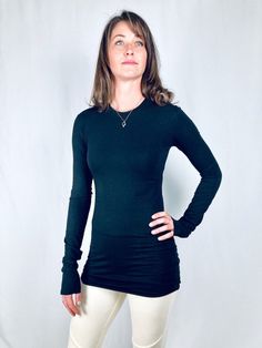 This crew neck tee is made fitted and with extra long bodice and sleeves for some stacking effect. Made with 66% bamboo, 28% organic cotton, 6% spandex jersey, it has a very soft feel with an elegant and stylish look. Wear it with your everyday jeans or dress it up with a chic trouser or dressy skirt and some jewelry. Also great for layering under a blazer, sweater or a sleeveless dress. Available in black and off white.Size Chart:Small Bust 33-36", waist 25-28", hips 36-39"Medium Bust 37-40", w Dressy Skirt, Blazer Sweater, Everyday Jeans, Dressy Skirts, Loungewear Set, Organic Fabrics, Long Sleeve Tunic, Crew Neck Tee, Long Sleeve Tee