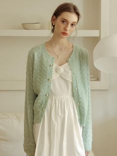 This is a bright mint cardigan with a wave pattern. It uses a three-dimensional pattern to make you look slimmer, and the neckline is also designed uniquely, making it an item with an overall feminine mood. - Opens and closes with rose button- Decorate with flowers on placket- A great item to wear as a layer in spring and summer Soft Summer Asian, Pastel Ootd, Light Spring Fashion, Mint Clothes, Mint Outfits, Spring Cardigan, Spring Feminine Cardigan With Buttons, Pastel Clothes Outfits, Mint Cardigan Outfit