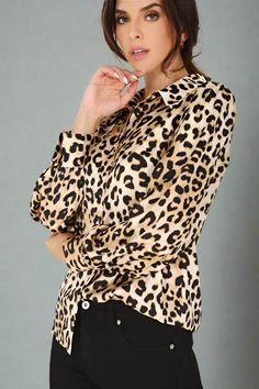 This leopard print blouse exudes luxury and sophistication. The soft, silky material provides a comfortable and stylish fit, making it a versatile addition to any wardrobe. With its eye-catching print this top is perfect for any occasion. Regular fit Long sleeves Material polyester Machine wash cold Model is 5'9" and wears US small S: 17.5" (Bust), 13.5" (Shoulder), 25.75" (Length), 21" (Sleeve Length) M: 18.5" (Bust), 14" (Shoulder), 26.25" (Length), 24.5" (Sleeve Length) L: 19.5" (Bust), 14.5" Chic Leopard Print Blouse For Fall, Chic Leopard Print Long Sleeve Tops, Chic Long Sleeve Leopard Print Top, Elegant Leopard Print Blouse For Spring, Elegant Leopard Print Blouse For Fall, Chic Leopard Print Tops For Work, Chic Fall Tiger Print Tops, Yoga Chic, Black Wardrobe