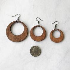 "★ Wood Hoop Earrings ★ Size choices: * Large - 1.5\" * Small - 1\" All wooden hoops come with fish hook earwire made of alloy metal (lead, cadmium & nickel free) These simple wooden earrings are a classic hoop shape that never go out of style. They are made out of stained birch wood and work with every outfit. Every piece of wood is different, the grain in your jewelry may differ slightly from the wood in the photograph. Water resistant. Not recommended to wear in shower. ★ SHIPPING * All p Brown Small Hoop Earrings With Ear Wire, Brown Hoop Earrings With Ear Wire, Brown Hoop Jewelry With Ear Wire, Brown Hoop Earrings Gift, Brown Hoop Single Earring, Brown Single Hoop Earring, Nickel-free Brown Hoop Jewelry, Hypoallergenic Brown Round Earrings, Brown Round Hoop Earrings For Gift