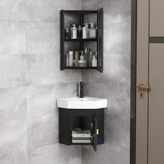 a bathroom sink sitting under a mirror next to a wall mounted cabinet with shelves above it