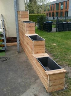 a set of stairs made out of wooden pallets on the side of a building