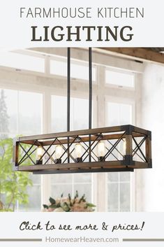 a chandelier hanging over a dining room table with flowers in the vases