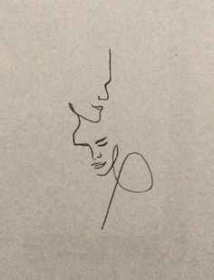 a black and white drawing of a woman's face next to a man's head