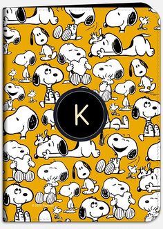 an ipad case with peanuts on it and the letter k surrounded by other cartoon characters