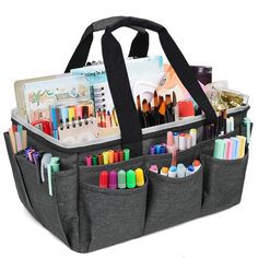 a large gray bag filled with markers, pens and pencils