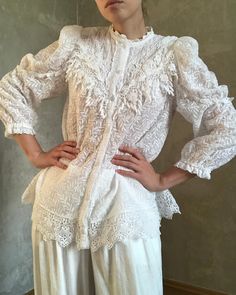 - size M-L - measurements: shoulders 36 cm (14 in), bust 102 cm (40 in), length 73 cm (28.5 in), sleeve 55 cm (21.5 in) - excellent condition Lace Puff Sleeve Top With Lace Collar, Elegant Fitted Lace Top With Broderie Anglaise, Fitted Lace Top With Puff Sleeves And Lace Collar, White Lace Top With Puff Sleeves And Lace Trim, Lace Broderie Anglaise Top For Wedding, Lace Puff Sleeve Tops With Lace Cuffs, Lace Tops With Broderie Anglaise For Wedding, Elegant White Lace Top With Broderie Anglaise, Lace Blouse With Ruffles And Puff Sleeves