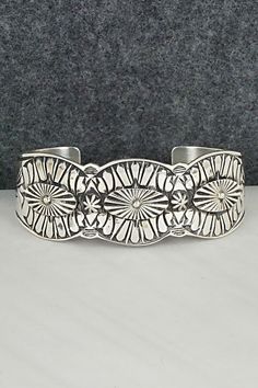 This intricate sterling silver bracelet was made by Navajo silversmith Derrick Gordon. The inside is signed Derrick and stamped sterling.Size: 5 7/8" (will fit up to a 7" wrist)Gap: 1 1/8"Length: 1"Free shipping on all orders! We ship with USPS and always include tracking. All orders ship within a day of payment.Returns are accepted up to 30 days after you receive your order. Just send us a message. Our shop offers cash back or store credit. The item must be returned in new condition. Sterling Silver Bracelet, Native American Jewelry, Bracelets And Charms, Free Jewelry, Featured Artist, Sterling Silver Bracelets, Sterling Silver Rings, Silver Bracelet, Gap