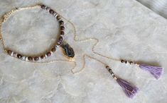 A boho wrap necklace stunner with a sparkly occo agate geode and lots of crystals in the center. The gemstones in the wrap necklace are natural faceted Peitersite in rich tones of brown, copper and caramel paired with Lepidolite in cool shades of dusty lavender. The lavender Lepidolite brings out the the subtle purple undertones in the Peitersite creating a unique statement for your boho chic look. This wrap necklace is a faux wrap, meaning it does have a clasp in the back to keep the necklace i Bohemian Crystal Necklaces With Natural Stones For Layering, Bohemian Gemstone Crystal Necklaces For Layering, Bohemian Gemstone Crystal Necklace For Layering, Bohemian Hand Wrapped Necklaces For Layering, Bohemian Lariat Necklace With Gemstone For Jewelry Making, Bohemian Agate Lariat Necklace, Bohemian Multi-strand Agate Jewelry, Geode Necklace, Dusty Lavender