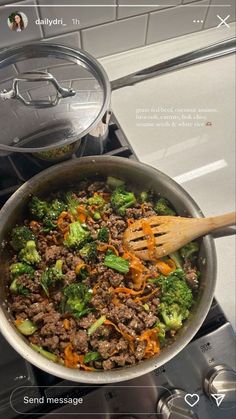 a pan filled with meat and broccoli on top of a stove