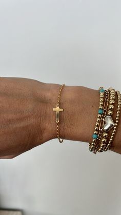 Simple Cross Bracelet, made from 14k Gold fill for everyday wear. Cross measures just under 3/4 inch across. Adjustable up to 1 inch. Oval Rolo chain. Our Jesus Bracelet. Comes in a smooth or hammered finish. Brown Cross Bracelet Spiritual Style, Elegant Metal Cross Bracelet, Spiritual Brown Cross Bracelet, Gold-tone Cross Jewelry With Adjustable Chain, Jesus Bracelet, Gold Cross Bracelet, Elegant Cross-shaped Metal Bracelet, Simple Cross, Cross Bracelet