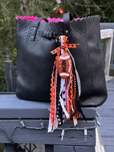 These Bag Tassels can be personalized with name, initials, school mascot, sport number. Please message specific color choices to match school colors, bag colors, or favorite colors. We can make most color combos! This tassel can hang on most any bags (big, simply southern, backpack, beach bag, etc.)  Let us help add some fun to any of your bags! Bag Tassels, Personalized Bag Tags, Tassel Bag Charm, Backpack Tags, Name Initials, Tassel Bag, Resin Charms, Simply Southern, Bag Tag