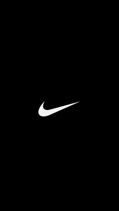 a black and white photo of a nike logo on a dark background with the word nike written below it