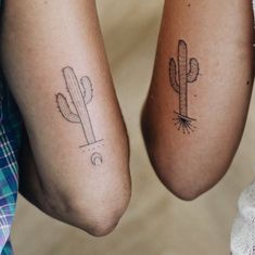 two people with matching tattoos on their legs, one has a cactus and the other has a moon