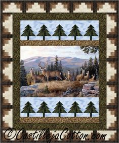 a quilted wall hanging with deer and pine trees in the background, on top of a patchwork border