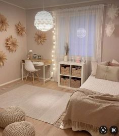 a bedroom decorated in neutrals and white with stars on the wall