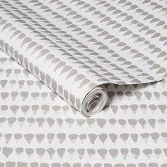 a white and grey wallpaper with an abstract design on it's surface,