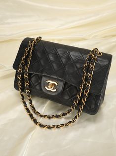 CONDITION:?ÿGOOD VINTAGE . Bringing to the shop a stunning, soft classic Lambskin Chanel flap. Excellent investment piece that?ÿcan be loved for years to come. Vintage Chanel crafted in the 90's= 24k hardware and soft buttery lambskin. Don't miss out on this gorgeous find. Can be as a long or short shoulder bag. Crafted between 1991-1994. Bag in this condition going online for $4800+. Please note: Hairline scratches on logo. Rubbing on edges as pictured. Hardware is in beautiful yellow gold condition! Please review all pics and ask any questions prior to purchasing! To prevent any form of fraud, I?ÿkeep video records of?ÿmyself?ÿpackaging?ÿand dropping off each order, and?ÿall?ÿorders ship with?ÿtracking and?ÿsignature?ÿconfirmation. Please ensure your shipping address is correct as we are Vintage Chanel Purse, Chanel Vintage Bag, Vintage Chanel Bag, Girl Backpacks School, Soft Classic, Bottega Veneta Shoulder Bag, Girl Backpacks, Vintage Chanel, Exclusive Bag