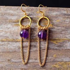 These Delicate Tassels Gothic Earrings exude elegance with their intricate beadwork and luxurious tassel detail. Add a touch of sophistication to your look with these stylish statement pieces. Material: Jade, Emperor jasper, Amethyst, Stainless steel Plating: Gold-plating Size: Around 6 cm Product condition: 100% New and Exquisite Quality. Returns: Money back guarantee (30 days free return) About Shipping: Your item will typically arrive in 7-14 days. Return Policy Contact us Elegant Purple Crystal Earrings With Dangling Beads, Elegant Purple Earrings With Dangling Beads, Elegant Latkans Earrings, Elegant Latkan Earrings With Round Beads, Purple Dangle Tassel Jewelry, Purple Dangle Jewelry With Tassels, Handmade Elegant Purple Tassel Earrings, Elegant Handmade Purple Tassel Earrings, Elegant Purple Tassel Earrings