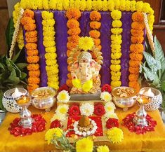 a gandap decorated with flowers and other decorations