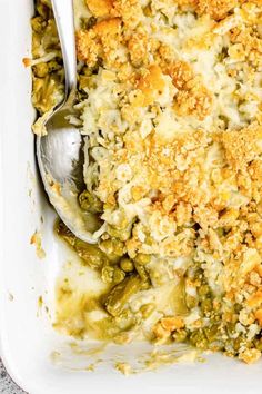 a casserole dish with broccoli and cheese in it, ready to be eaten