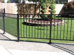 a black metal fence in front of a house