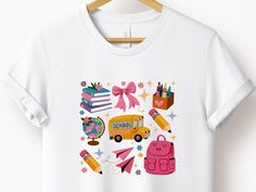 Back to School Coquette Shirt, School Bus Shirt, Back to School Sublimation Design, First Day Of School, Teacher Gift,Kindergarten,Preschool ------------------------------------------ 👕 Welcome to byTDG! 👕 💖 TDG wishes you a pleasant shopping experience. 👕  We are here to offer you the most suitable shirt options. We want to make everyone smile with our cute, stylish and trendy graphic t-shirts. We can assume that this shirt will be the perfect gift for yourself or someone else.   Be sure to White T-shirt With Funny Print For Back To School, Pink T-shirt For Back To School, Playful Multicolor Shirt For School, Pink Custom Print T-shirt For School, Casual School Shirt With Character Print, Multicolor Funny Print T-shirt For School, Pink School Spirit T-shirt For School, Pink T-shirt For End Of School Year, Back To School White T-shirt With Funny Print