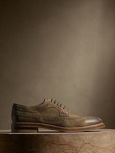 A timeless choice for those who prefer a bit of ornament, this handsome suede brogue had signature detailing, a wingtip toe, and beautifully burnished finish—a testament to Portuguese craftsmanship.  Suede uppers.  Waxed laces.  Leather soles.  Mad Leather, Beauty