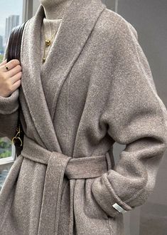 Indulge in the luxurious sophistication of our Olivia Wrap Long Wool Coat. Crafted from high-quality wheat and black wool, this winter coat features a stylish wrap design and a long silhouette that will keep you warm and stylish throughout the season. Elevate your wardrobe with this exclusive overcoat that exudes elegance and taste. Details & care Wrap Belted closure 70% wool,polyester Women's coat Item #312262 Machine wash, dry flat Size info XS=US2=UK6=EU32 S=US4-6=UK8-10=EU34-36 M=US8-10=UK12 Unlined Wool Coat, Sweater Coats For Women, Oversize Coat Outfit, Coats For Women Classy, Wrap Coat Outfit, Winter Wrap Coat, Oversized Coat Outfit, Grey Wrap Coat, Womens Overcoat