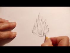 someone is drawing a flower with a pencil