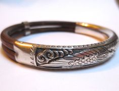 Shown here for your consideration is this great vintage Chinese bangle bracelet. Dating from the 1920-40's. When I spotted this in an antique store I had to buy it. Made of silver and bamboo. Its fine detail depicts a graceful phoenix bird. Silver panel spans 4 1/2 inches across its outer edge. Inner measurement is 7 1/2 inches around. Opening is 2 3/8 inches wide. Bracelet is 3/8 of an inch wide. The piece is hallmarked silver and has been carefully tested to ensure the metals purity. In very g Saddle Ring, Phoenix Bird, Lavender Green, Gold Cocktail, Gold Cocktail Ring, Jade Ring, Blue Zircon, Antique Stores, Earrings Photo