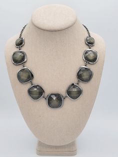 Vintage NY Brand Black Gunmetal & Shimmering Green Faceted Stone Bib Necklace  This pretty necklace makes a great statement piece.   A black gunmetal cable chain necklace secures with a lobster claw clasp & is adjustable for length.  The chain is affixed at both ends to a linked bib of rounded square-shaped settings that hold large faceted dark green shimmering stones.  This piece is in excellent, nearly new condition.    Dimensions: 23 inches in length maximum Clasp: Lobster Claw Markings: NY Condition: Excellent - nearly new All of my shop items are pre-owned vintage.  All pieces should be expected to have some vintage wear unless otherwise stated.   Great for the vintage & costume jewelry lover!  Be sure to check out our other vintage jewelry listings! Looking for something that isn't l Adjustable Gunmetal Jewelry For Formal Occasions, Adjustable Gunmetal Necklaces For Party, Adjustable Gunmetal Necklace For Party, Gray Metal Chain Necklace, Adjustable Gray Metal Necklace, Gunmetal Metal Necklace For Formal Occasions, Formal Gunmetal Metal Jewelry, Adjustable Nickel-free Gunmetal Necklace, Adjustable Gunmetal Nickel-free Necklace