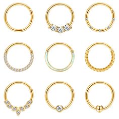 six pairs of gold nose rings with diamonds