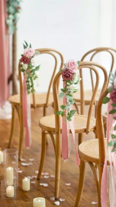 the chairs are decorated with flowers and ribbons