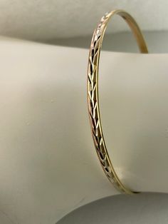 14kt Tri-Gold bangle bracelet 6.1 grams of Gold 14k Gold Stamped Bangle Bracelet, Hallmarked 14k Gold Bangle Bracelet, 14k Gold Chain Bangle Bracelet, Flexible Gold Bangle Bracelet, Flexible 14k Gold Bangle Bracelets, Fine Jewelry 14k Stamped Bangle Bracelet, 14k Gold Hallmarked Bangle, 14k Gold Diamond Cut Bangle, Sevierville Tn