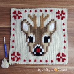 a crocheted blanket with a deer's head on it