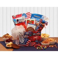 a patriotic gift basket filled with cookies, crackers, and snacks on a table