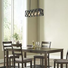 a dining room table with chairs and a chandelier hanging from it's ceiling