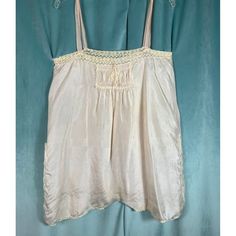 Good condition, some darkening at bottom, item was cleaned. Is now a camisole instead of a romper. Bust 37, hip 44. Feminine Tank Top With Adjustable Straps For Daywear, Feminine Camisole Tank Top For Daywear, Feminine Camisole Tank Top, Feminine Tank Camisole For Daywear, Daywear Camisole With Built-in Bra And Tank Straps, Camisole With Built-in Bra And Tank Straps For Daywear, Vintage Sleeveless Top With Built-in Bra, Daywear Tank Top With Adjustable Straps, Feminine Camisole With Built-in Bra For Daywear