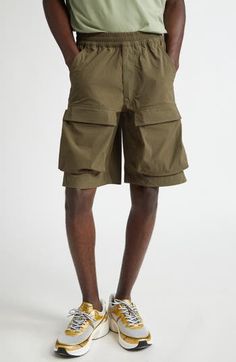 An ideal blend of function and fashion, these cargo shorts feature an elasticized waist, capacious pockets and a knee-grazing Bermuda silhouette. 10 1/2" inseam; 24" leg opening; 12" front rise; 17 1/2" back rise (size 50EU) Elastic waist Front scoop pockets; back button-welt pockets; cargo flap-patch pockets 85% polyamide, 15% elastane Hand wash, dry flat Made in Portugal Designer Clothing Utility Bermuda Bottoms With Built-in Shorts, Utility Bottoms With Built-in Shorts For Outdoor Activities, Knee-length Utility Shorts With Side Pockets, Utility Bermuda Shorts With Built-in Shorts, Summer Knee-length Cargo Pants With Built-in Shorts, Outdoor Relaxed Fit Cargo Pants With Built-in Shorts, Sporty Bermuda Cargo Shorts With Side Pockets, Nylon Cargo Pants With Built-in Shorts For Outdoor, Military Style Khaki Cargo Shorts With Multiple Pockets