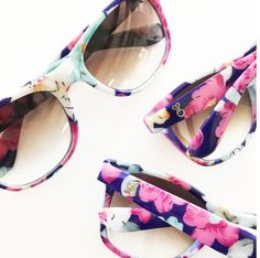 three pairs of sunglasses with floral print on them