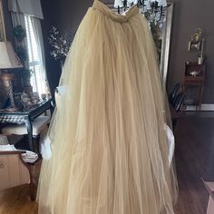 This Is A Custom Made Tulle Skirt In A Champagne Color By Sweet Caroline Styles. The Top Is An Ivory Lace With Gold Accents. It Is A Women’s Size 6 And Is Brand New And Comes With The Original Dress Bag. The Top And Skirt Were Originally Sold Separately. The Savannah Top Was $350.00 And The Norma J Skirt Was $1,350.00 Elegant Full Skirt Tulle Bottoms, Tulle Flared Skirts For Wedding, Tulle Flared Wedding Skirt, Flowy Beige Skirt For Wedding, Beige Flowy Skirt For Wedding, Spring Wedding Full Length Skirt, Spring Wedding Beige Skirt, Spring Formal Tulle Skirt, Elegant Beige Tulle Skirt Bottoms