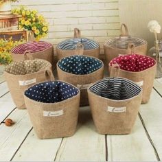 six baskets with polka dots on them sitting on a table