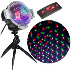 an image of a disco ball light with remotes on the tripod and in front of it