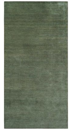 an area rug with green tones