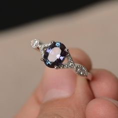 This is a gorgeous handmade creation. Its beauty is its simplicity & Elegance. The 6*8 mm oval shape faceted lab alexandrite is crafted in solid sterling silver and with rhodium plated. All item is sent in a beautiful gift box!!! If you have any idea of design your ring,pls contact me directly. Oval Tanzanite Birthstone Ring With Accent Stones, Elegant Oval Tanzanite Birthstone Ring, Oval Birthstone Ring With Gemstone Accents, Oval Tanzanite Birthstone Ring, Tanzanite Oval Birthstone Promise Ring, Oval Purple Sapphire Rings, Purple Sapphire Oval Ring, Oval Tanzanite Birthstone Promise Ring, Oval Sapphire Ring With Gemstone Accents